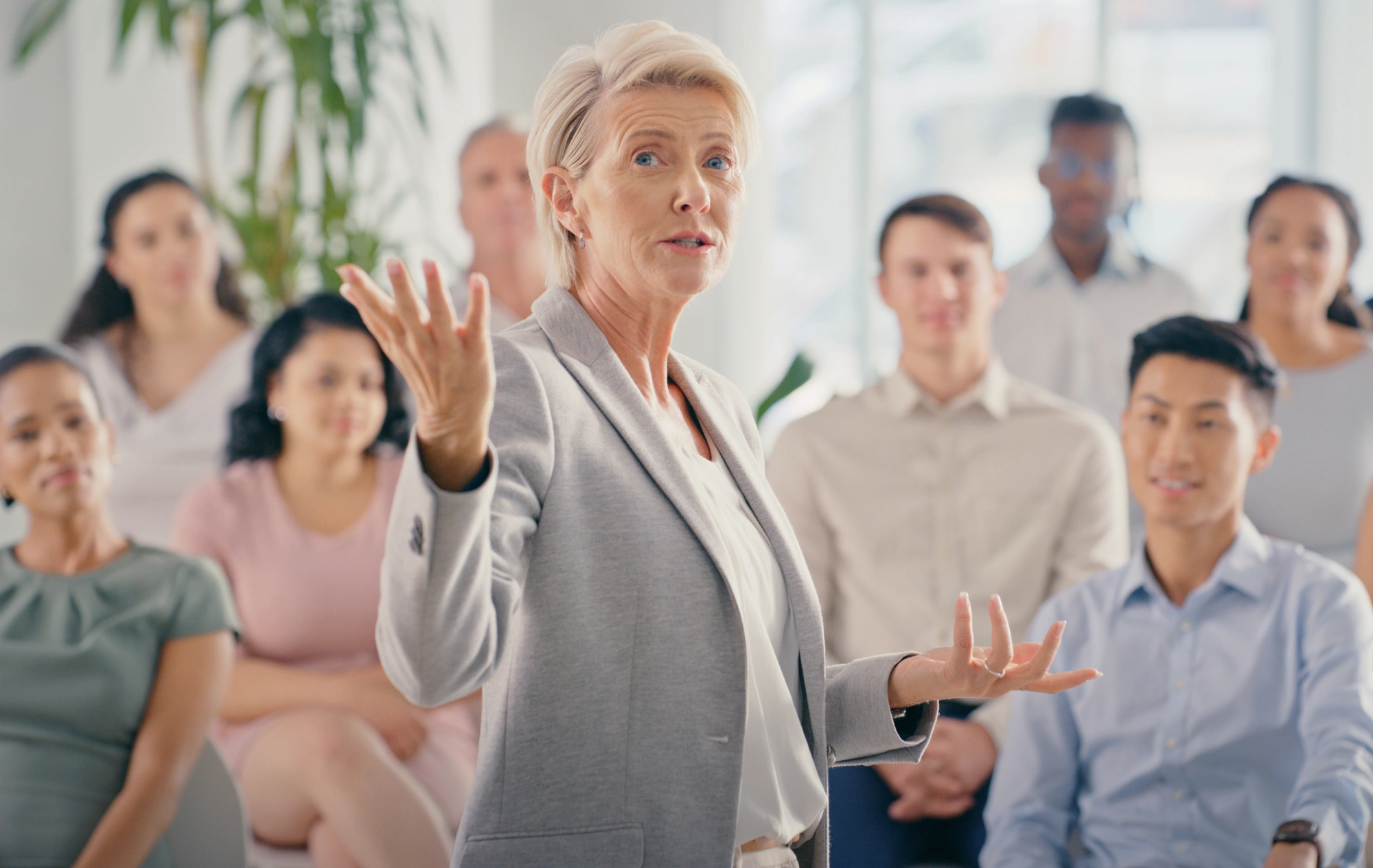 Speaker addressing a diverse group of people.