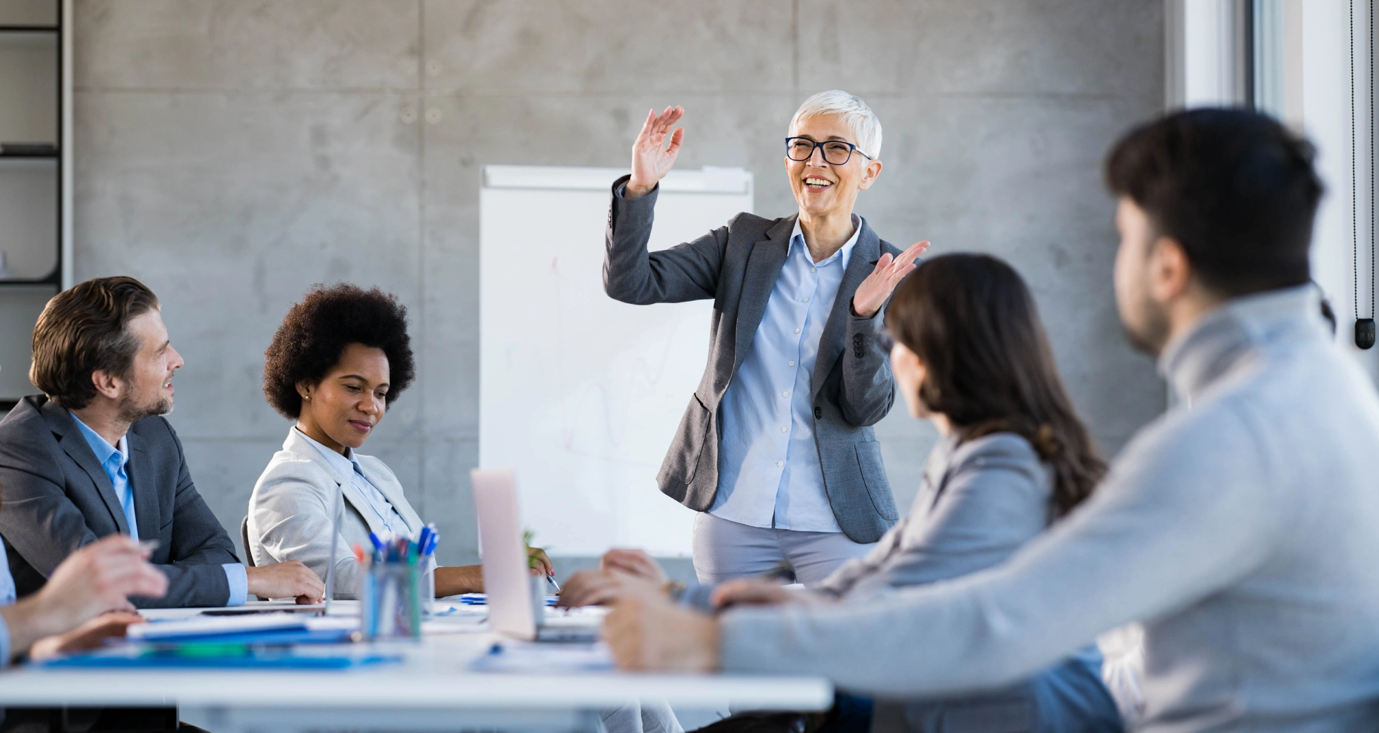 Business meeting with a presenter leading discussion.
