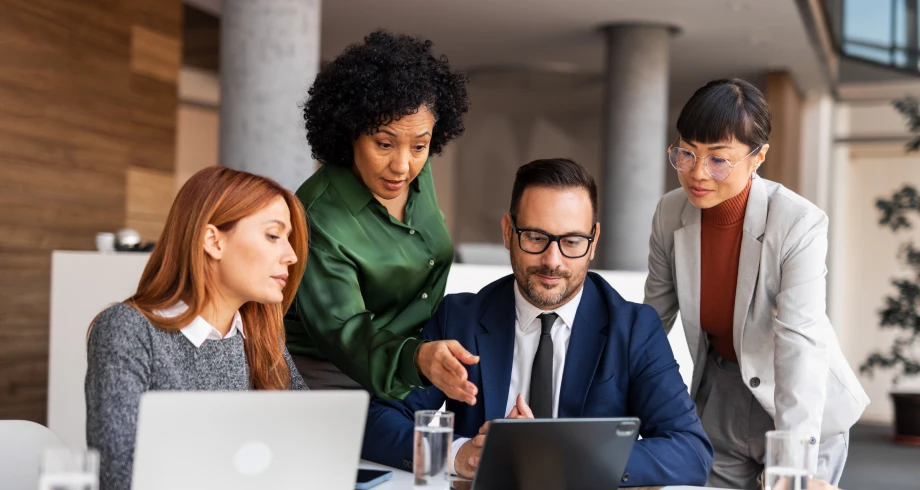 Business team discussing around a tablet